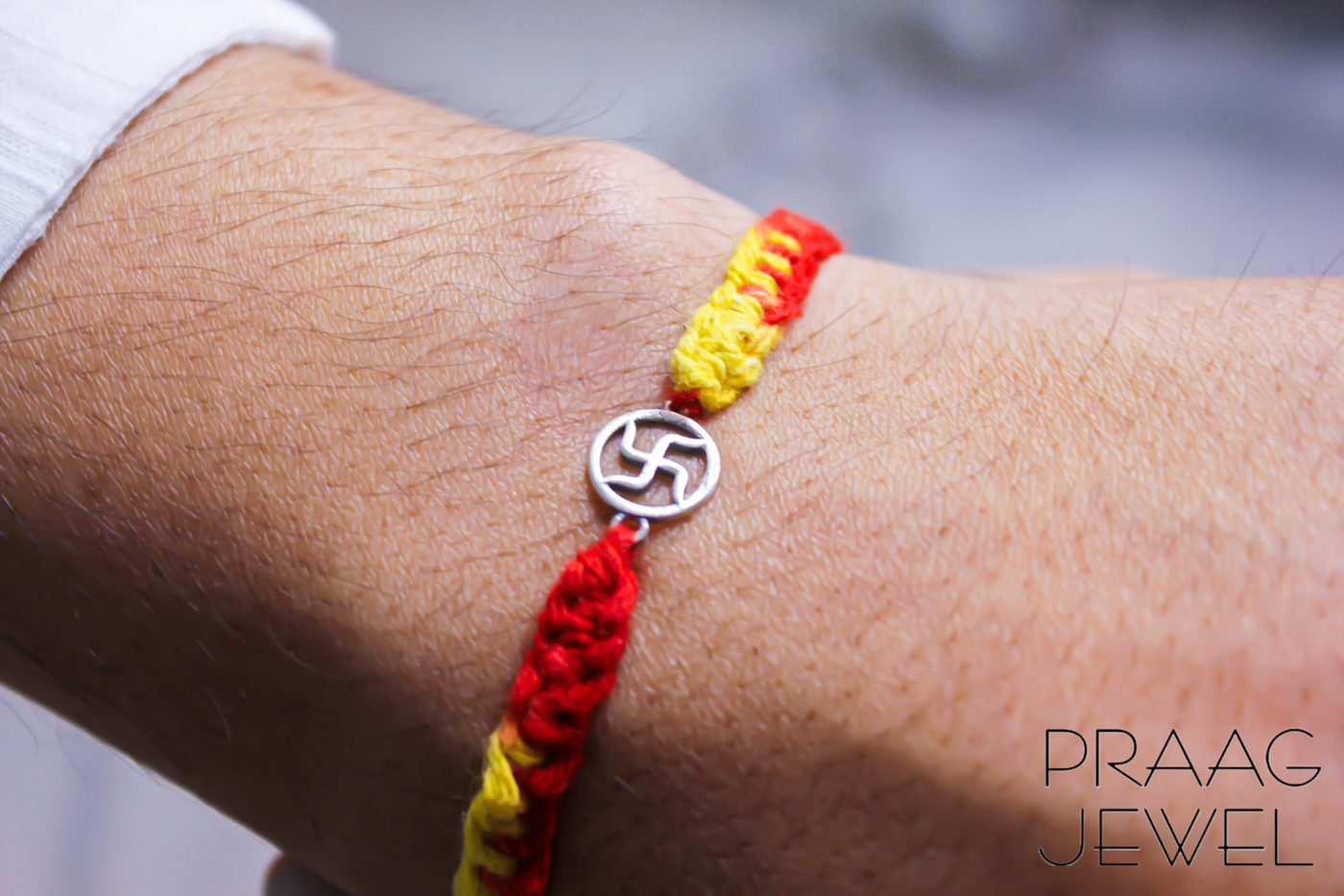Buy or send Golden Ganesha Rudraksha Rakhi Bracelet with Online